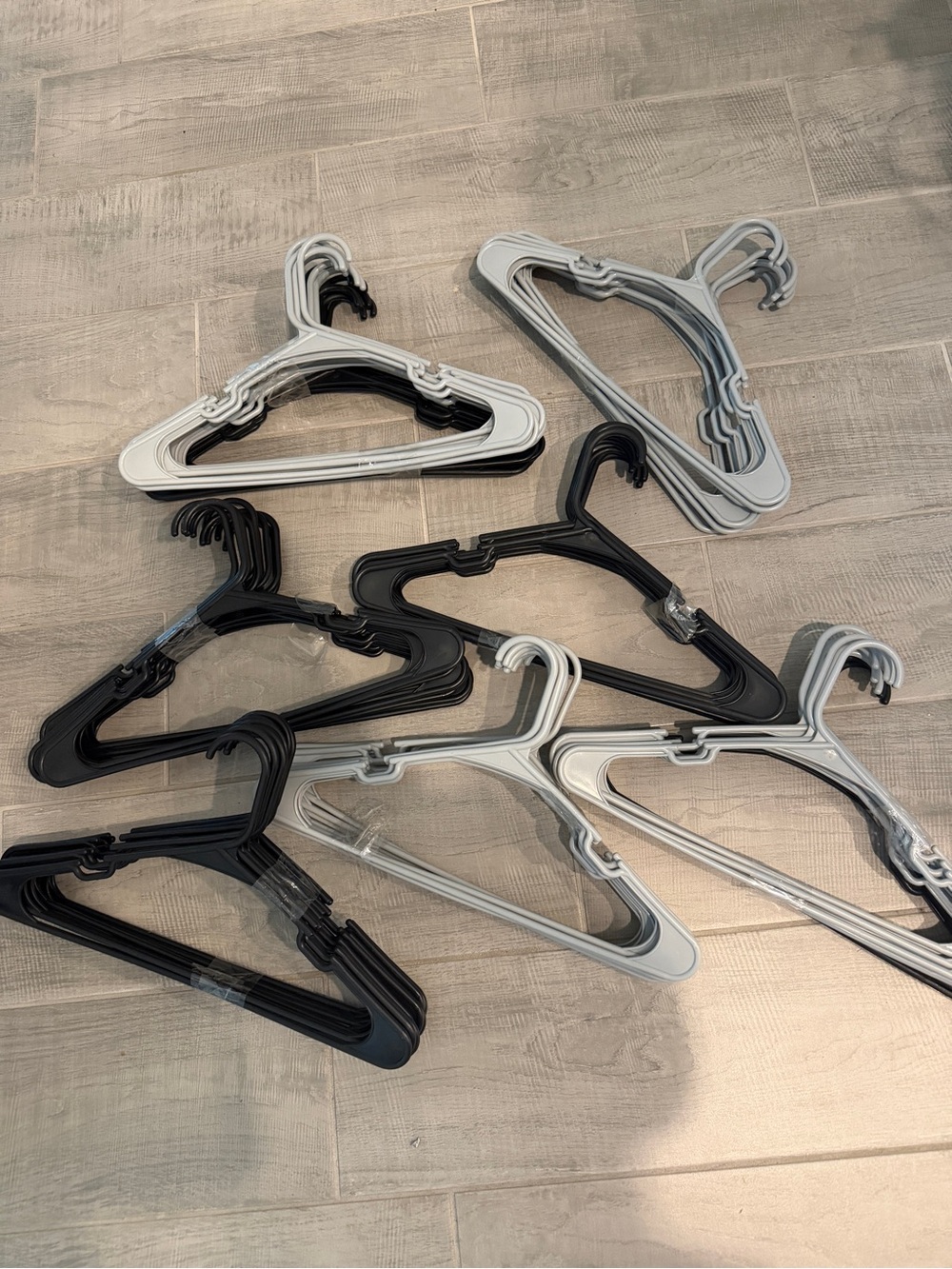 Pack of Black and Light Gray Plastic Hangers